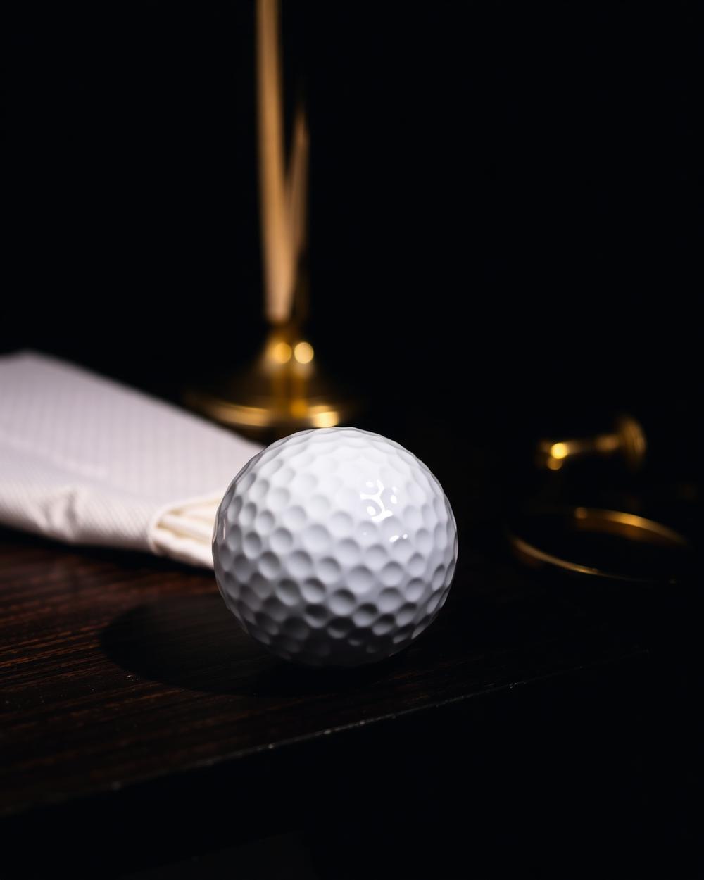 Premium golf ball and brass barber shears